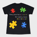 Black t-shirt with colorful puzzle pieces and text on a white background